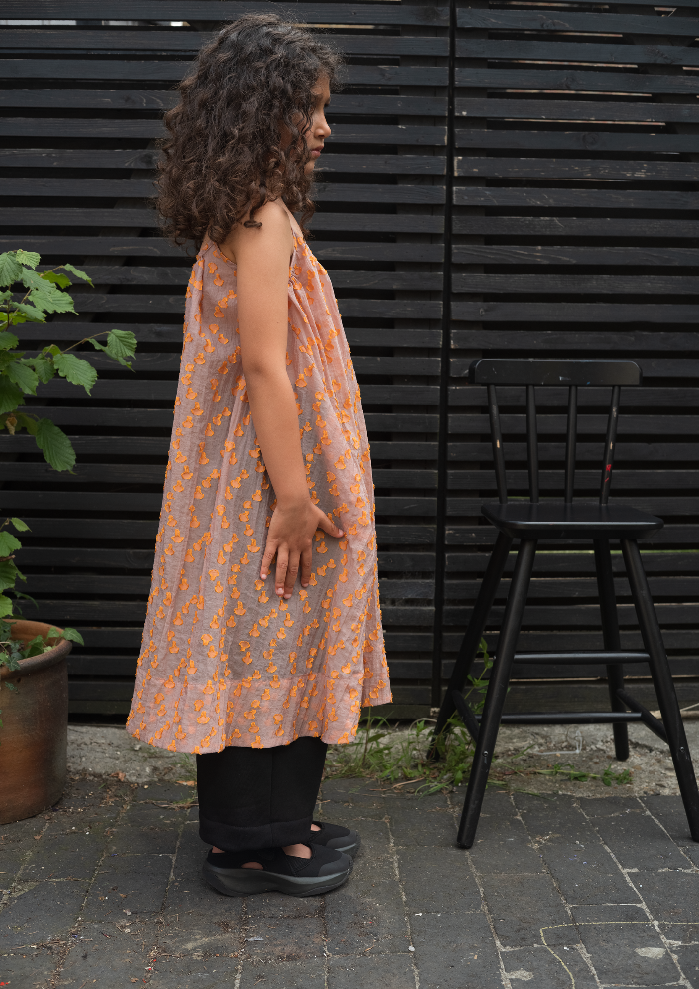 Side view of Cleo A-line dress showing adjustable shoulder straps