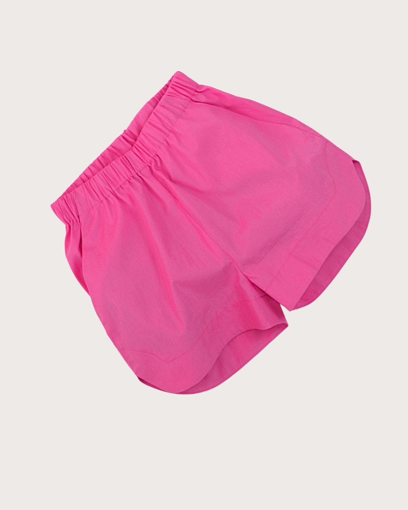 Back view of unisex kids pink shorts with elasticated waistband