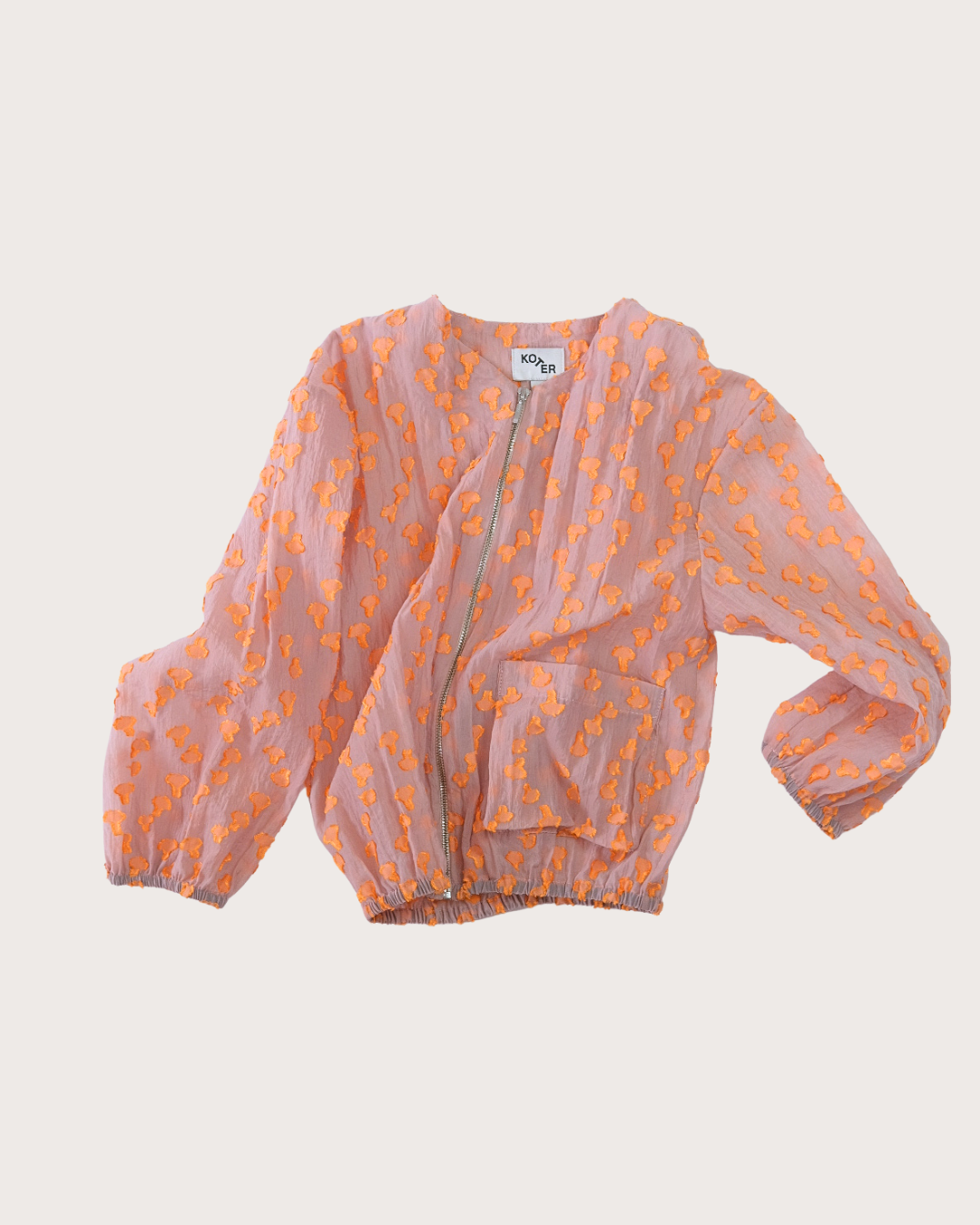 Koko sheer dot bomber jacket in pink with orange textured dots, modern unisex kidswear