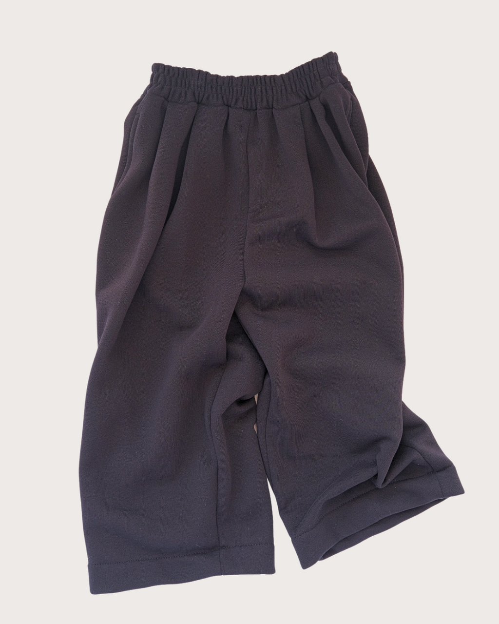 Noa black wide leg pleated joggers for adults by Studio Koter