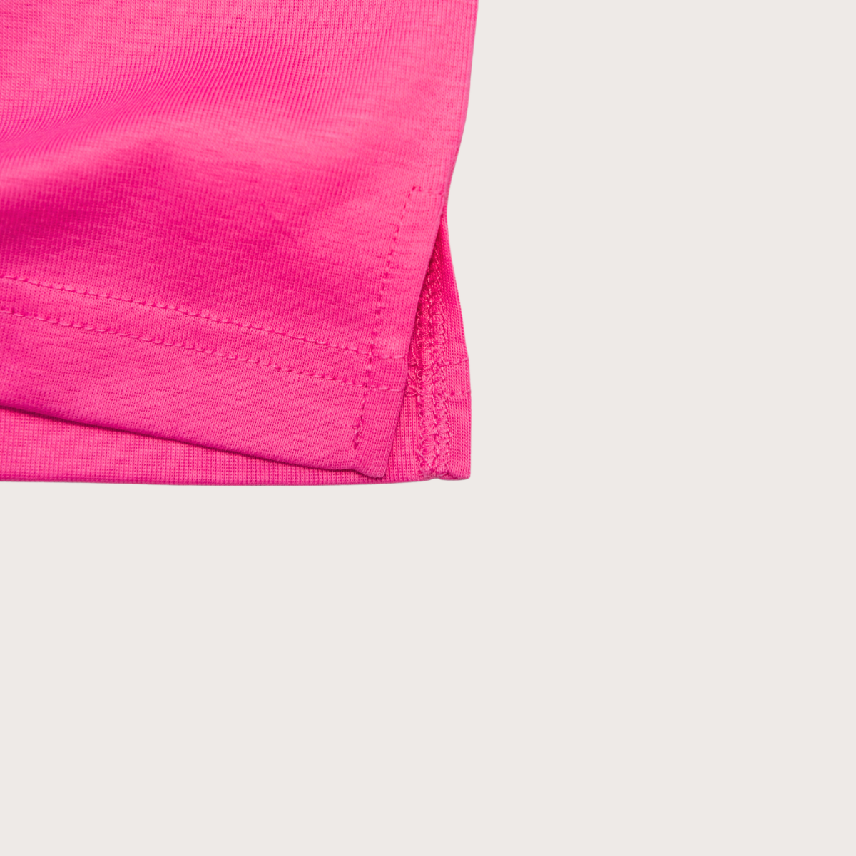 Close-up of mercerized organic cotton fabric on Rory t-shirt pink